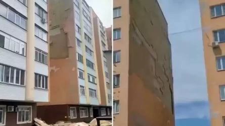 Алматыда қатты желдің салдарынан 9-қабатты үйдің қаптамасы опырылып түсті