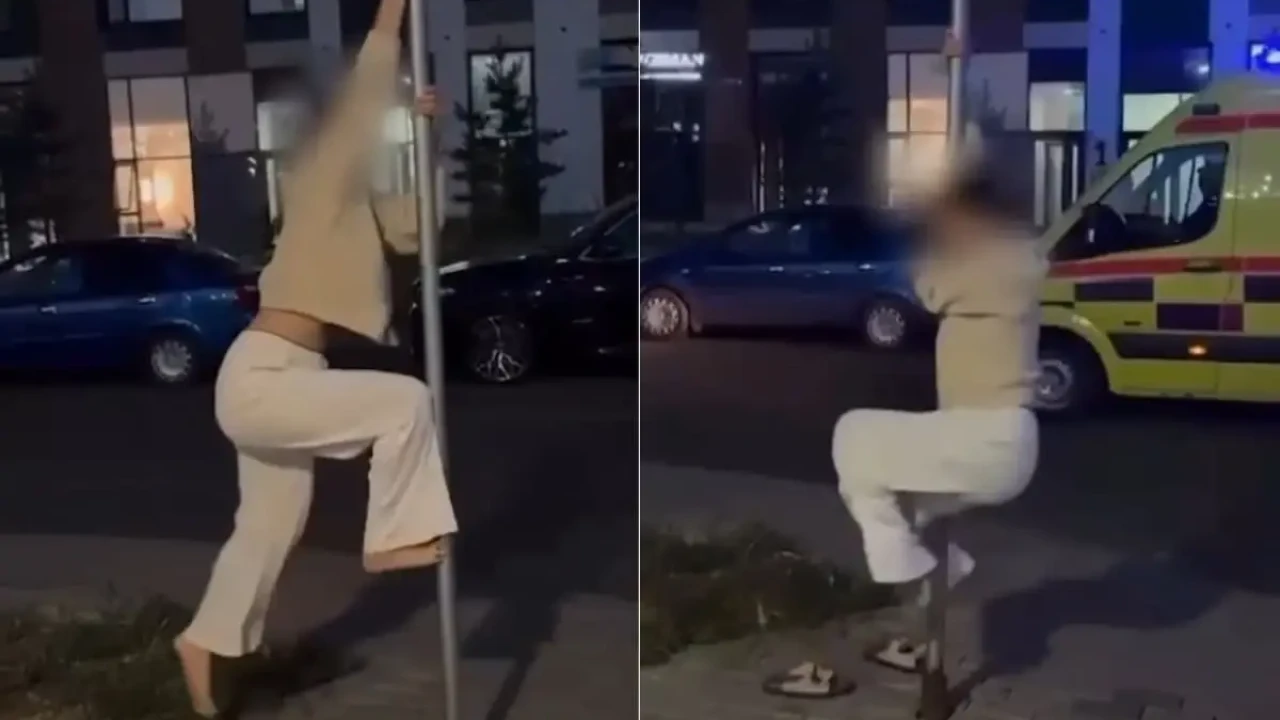 Астанада жол белгісіне өрмелеп стриптиз билеген бойжеткенге айыппұл салынды